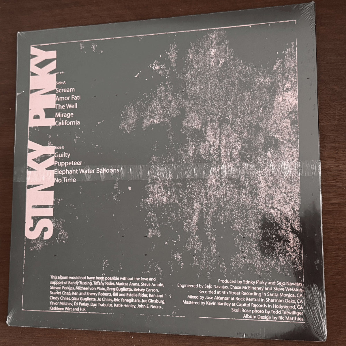 Stinky Pinky - A Ruse By Any Other Name - back cover with Side A and Side B tracklist and credits, sealed